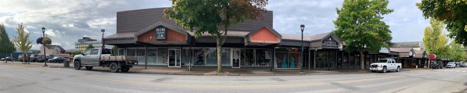 current streetscape in the 4600 block of Lakelse Ave, showing large canopies over business frontage