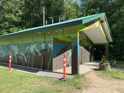 Partially completed mural on Ferry Island washroom building