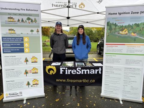 City of Terrace FireSmart Coordinator Kim Service (right) at the farmers market, talking to the public, with Gabriel Courchesne-Normandin of the BC Wildfire Service.